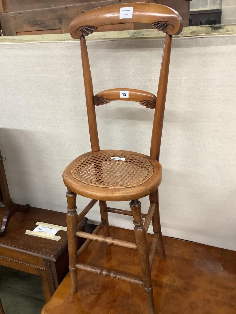 A Victorian beech caned seated correction chair, height 96cm